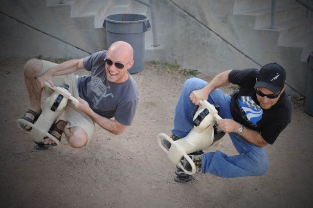 Ruffians acting out their motorcycle passions on helpless playground horses - Composite Image