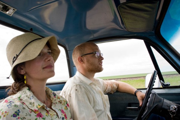 Andy, Natalie, Leo, and I driving out to the Vandalia pasture to build fence.