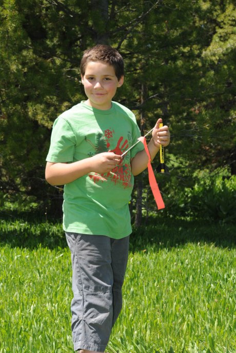 Payload Engineer Gage inspects the rocket after its maiden launch.