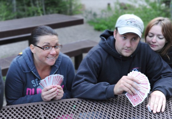 My niece Crystal, nephew Eric, and Sidney who's either spying on Eric's cards or taking a nap.