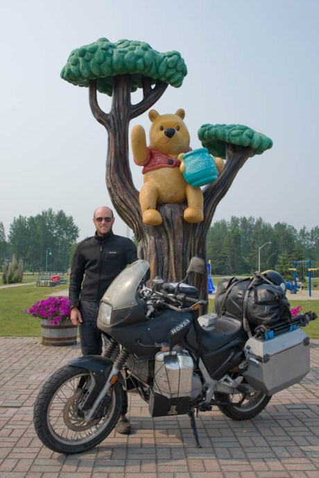 The Camel and I pose with Winnie-the-Pooh while he eats his breakfast of honey and, um, more honey.