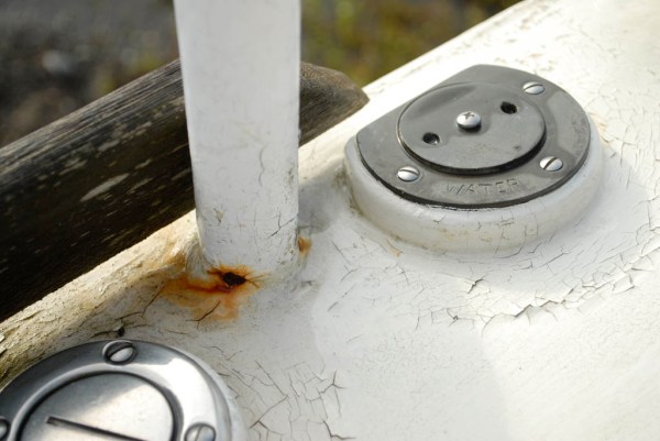 Paint cracking and rusting around the stanchion bases.