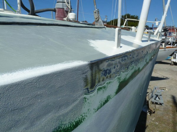 Edge of the deck ground and feathered into the old and new paint, with new white primer following close behind.
