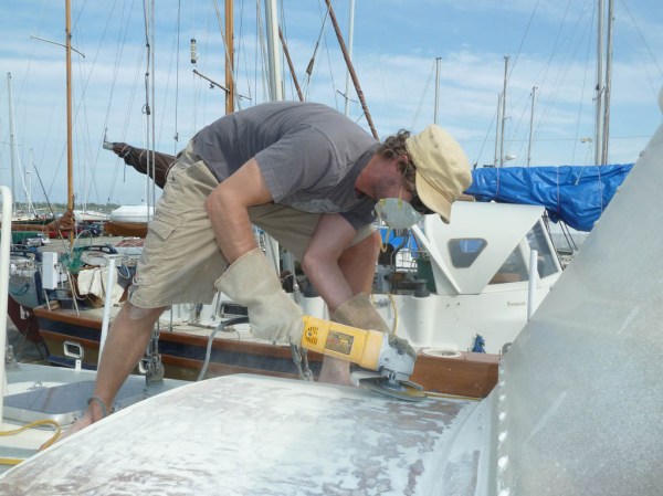 Jason grinding the paint off the hatch cover.