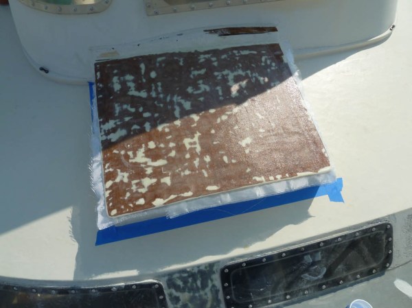 Four new layers of 8 oz fiberglass cloth set in epoxy resin.