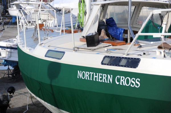 The hull after the three coats of green paint and the new white name hand painted on.