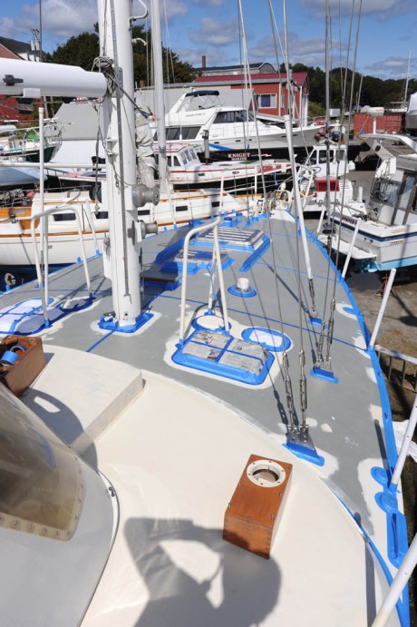 Masking off areas to remain free of non-skid.