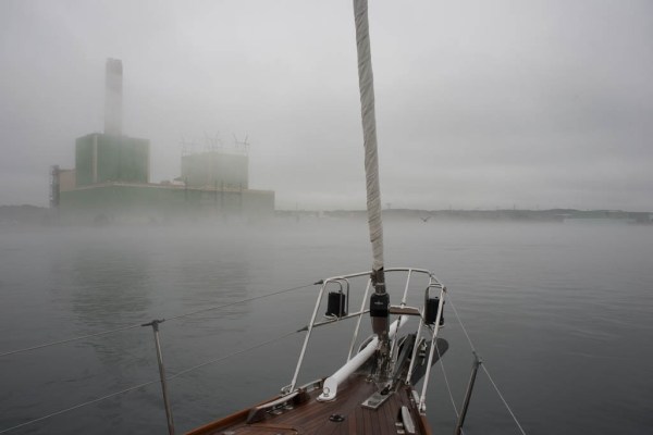 Motoring through the middle of the canal with the sides barely visible.