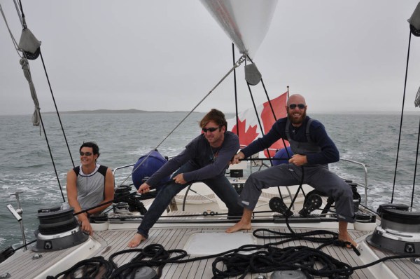 Nicolas and I trying to look important while Santiago does the real work - pushing the button for the hydraulic jib sheet winch. (Photo by Dad)