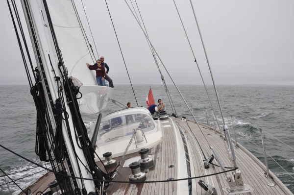 Mom and I standing on the end of the boom while reaching along at 8 knots under full sail and far from the sight of land. I can't say I know many other great-grandmothers who are this adventurous!! (Photo by Dad)