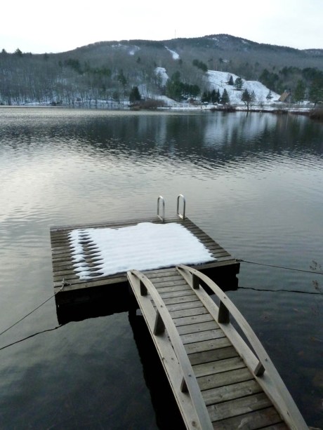 Camden Snow Bowl rising above Hosmer Pond.