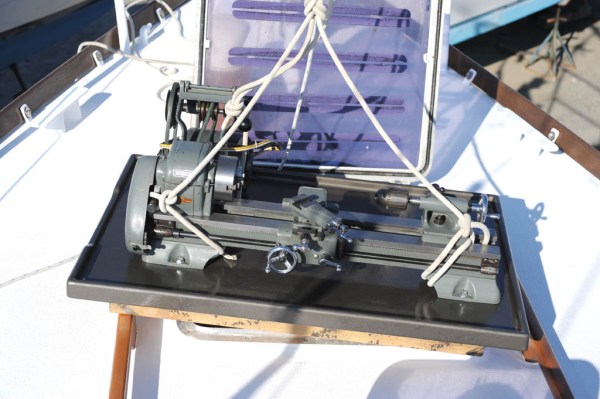 The lathe and worktable at rest before going down the hatch.