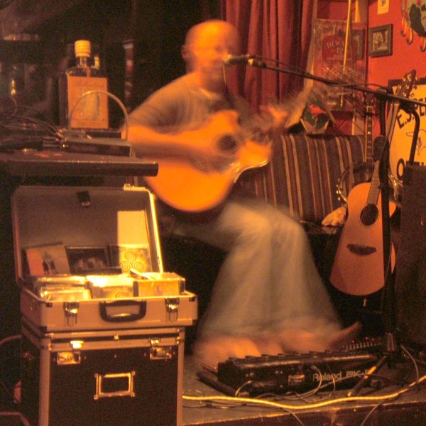 Davey Armstrong of "Four Feet Two Shoes" playing the harmonica, guitar, and foot organ all at the same time.
