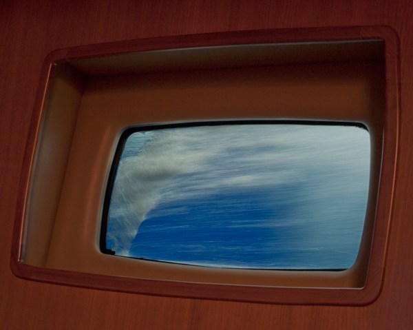 Watching the ocean speed past through a portlight that's usually several feet above the waterline. Watching the ocean speed past through a portlight that's usually several feet above the waterline.