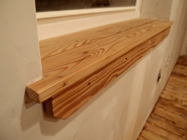 Finally getting to the finish trim stage, all of which was recycled from unused sections of the original hardwood floor.