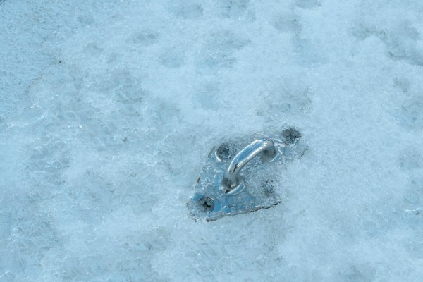 Staysail leads on deck all but buried in snow.