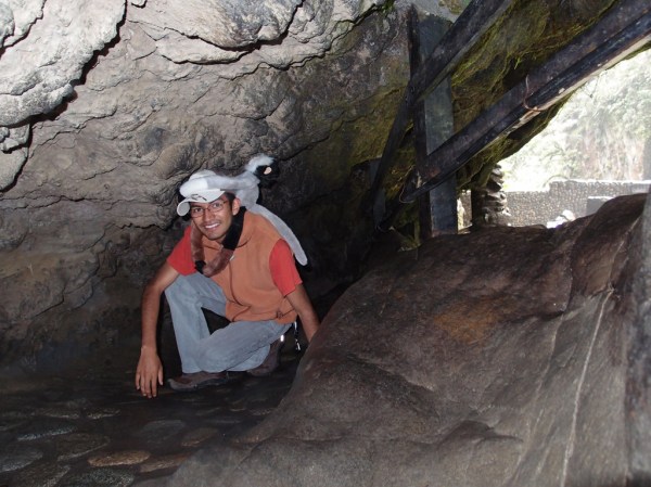Freddy navigates the increasingly cave-like trail that leads to the precipice of the Pailón del Diablo waterfalls. Freddy navigates the increasingly cave-like trail that leads to the precipice of the Pailón del Diablo waterfalls.