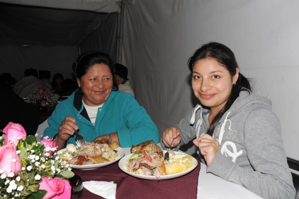 Elvia and Diana enjoying a feast before the dancing begins.