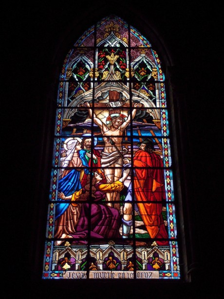 One of many massive, ornate stained glass windows.