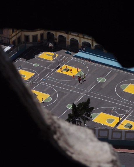 Spying on a game of basketball from the clock tower.