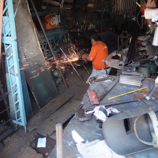 Grinding a repair to a folding chair.