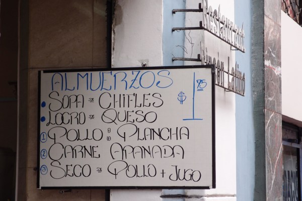 A typical lunch special - soup, bread, a main course of meat and rice, and juice. All for $1.75 US.