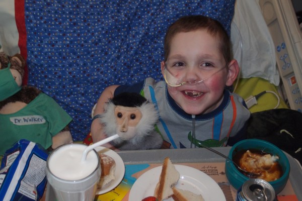 Tristan sneaking a bite of Tayt's milkshake.