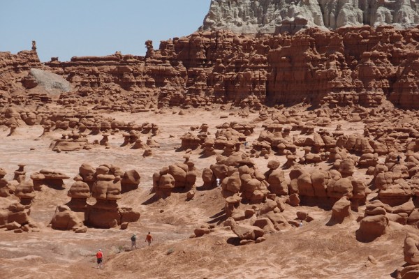 People explore the labyrinth of Goblin Valley.