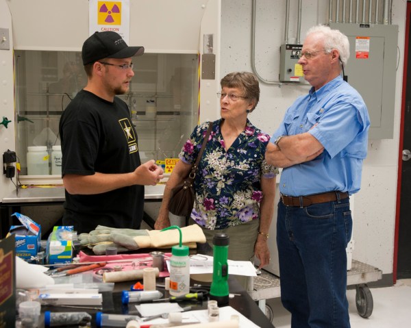 Eric explaining to Mom and Dad how the lab creates medical isotopes of copper from zinc.