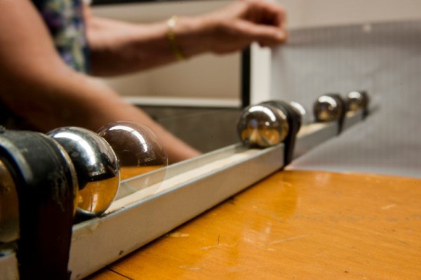 One of the physics demonstrations used in the outreach program, this one is a magnetic linear accelerator simply made from magnets and ball bearings.