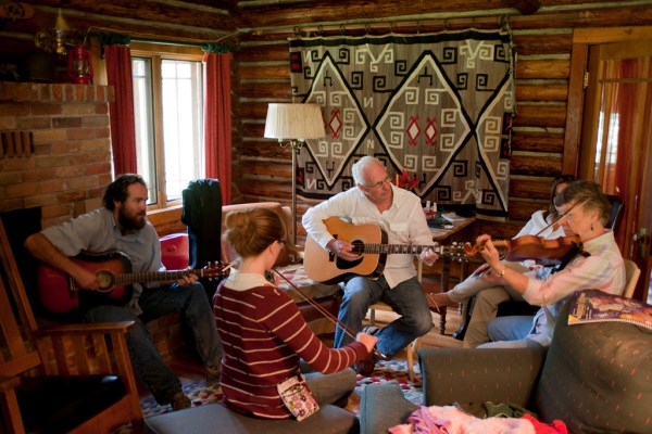 James, Grace, Dad, and Mom serenade the cabin with music.