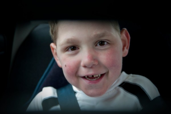 Happy to be in his car seat. Even happier to be headed to....