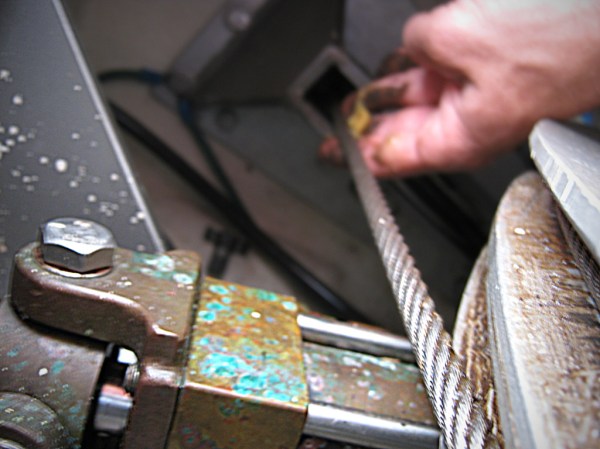 Tensioning and lubricating the steering cables.