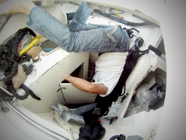 Digging through the line locker to access the bow thruster.