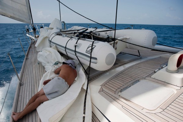 Gary taking a nap in the staysail before his first watch of the passage.