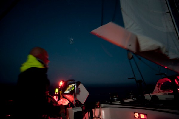 Hand steering under double reefed main and staysail after a small rain squall.