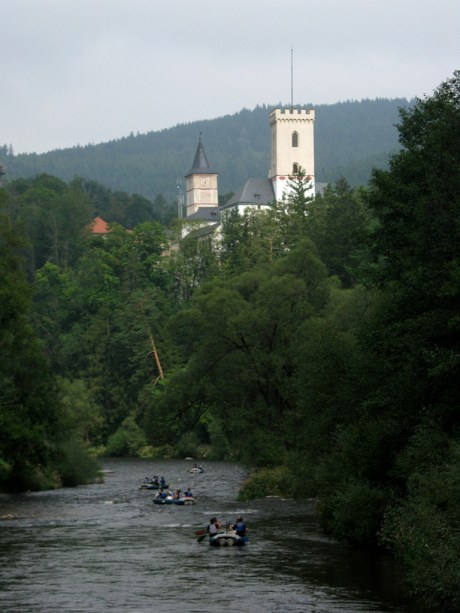 Rafters float along the town of Rožmberk nad Vltavou near the head of the great Vltava River.