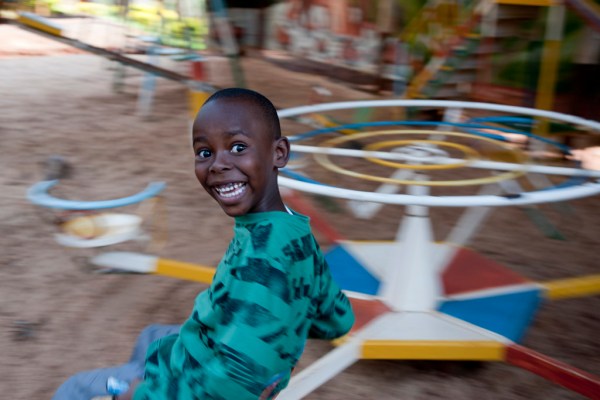 Freddy enjoying the playground at Brian's Uncle's resort in Mukurwe-ini.