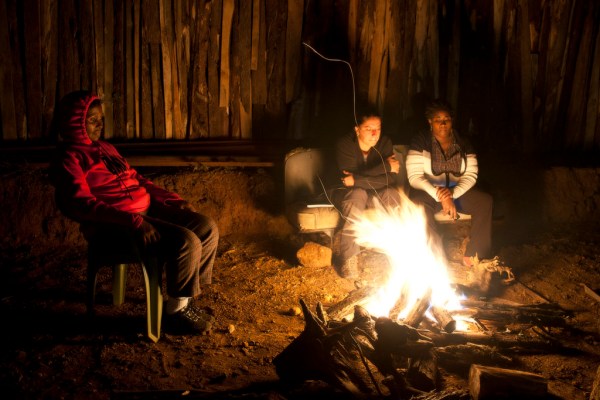 Maito, Eugenia and Barbra enjoy the campfire.