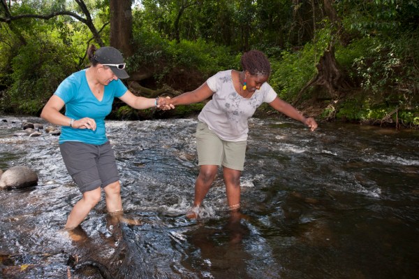 Eugenia and Barbra brave the frigid waters to find skipping stones.