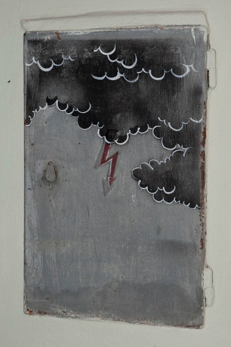 An artistic addition to a "high voltage" electrical panel.