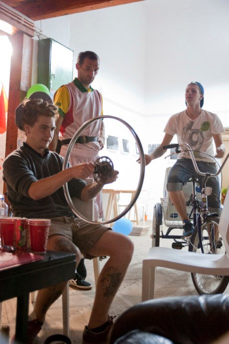 Či Ćo trues a wheel for one of the many bicycles calling the Center home.