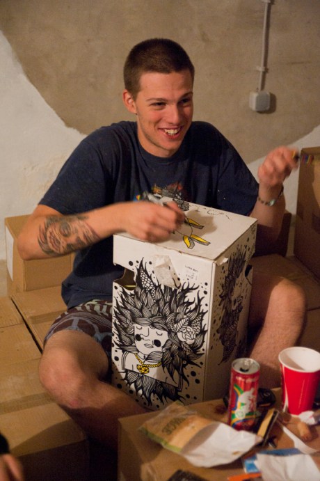 Tameo making sure there isn't a square inch of the box left untouched.