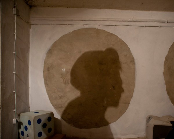 Či Ćo's silhouette on the basement wall, where soon they will paint murals.