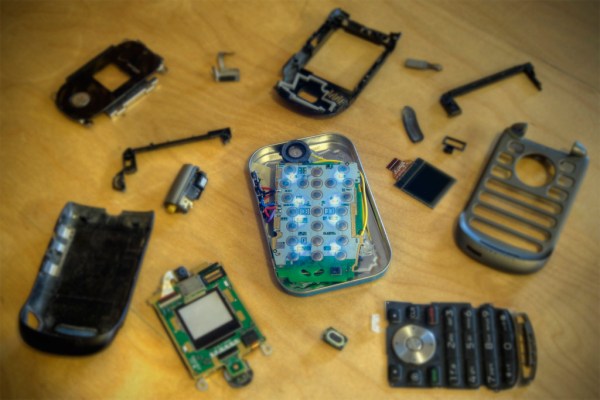 Refusing to let my old phone die and succumb to Verizon's evil ways, I rebuilt the still-working parts into an Altoids tin.