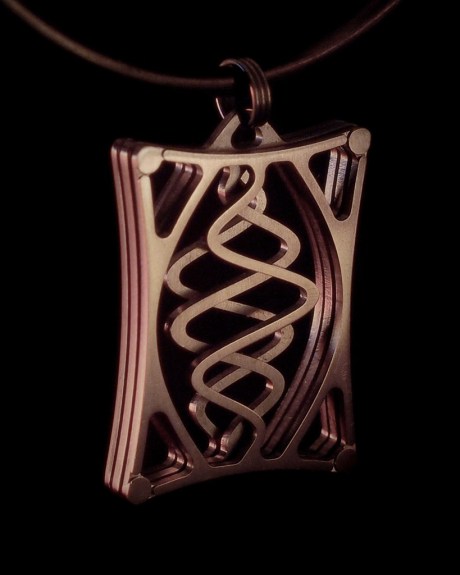 And of course some detailed work, here a pendant CNC machined from layers of 0.040" titanium, assembled with ground-flush #0 screws.