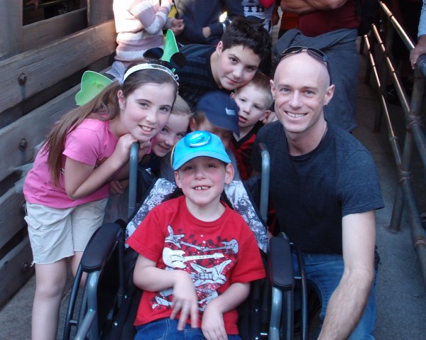Corly, Devony, Tayt, Jace, Gage, Jackson and Uncle Ryan in line for the Cars ride.