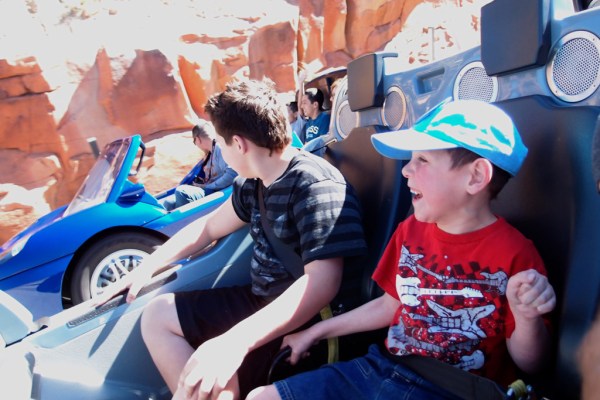 Gage and Tayt cheer as we gain on the car we're racing.